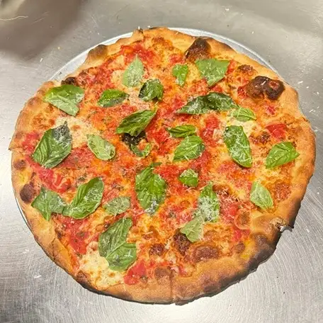 Community members enjoying pizza at Johnny's Pies in Medford, NJ