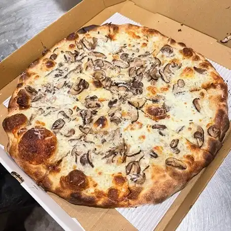 Fresh artisan pizza slice from Johnny's Pies Medford NJ